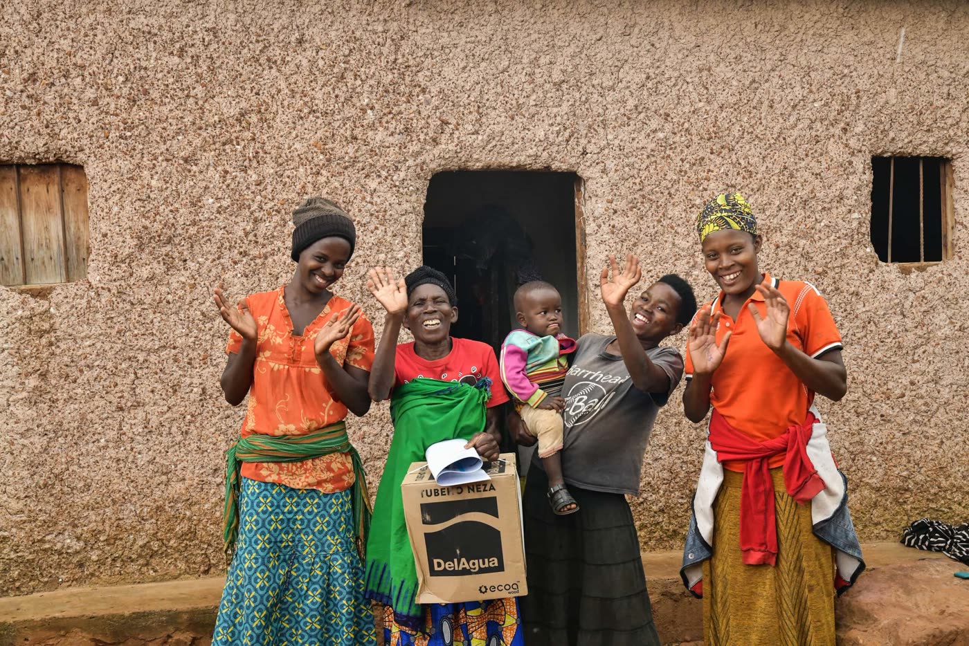 Family with a Tubeho Neza cookstove in rural Rwanda